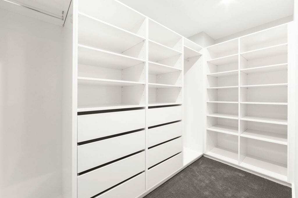 Homes by Howe, new build, Denman, walk-in-wardrobe, floor to ceiling white shelving and draws, grey carpet
