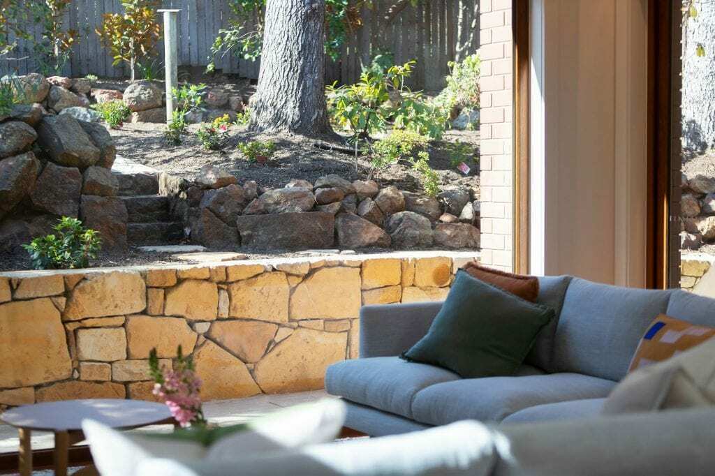 Homes by Howe Canberra builder – Governor Generals' renovation extension – Family room with stone retaining wall