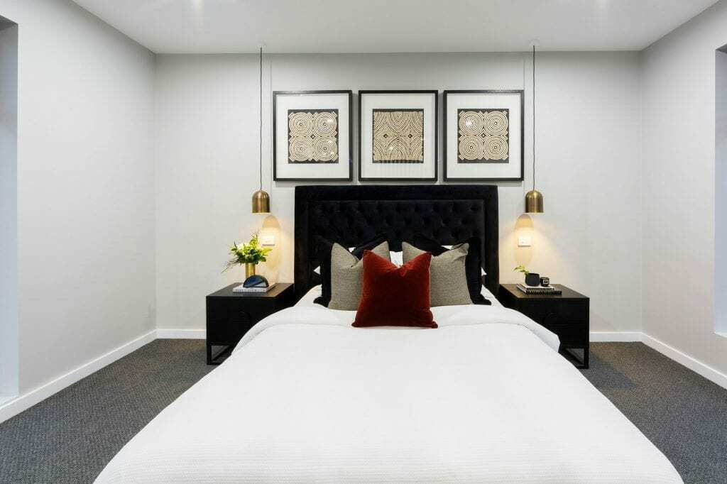 Homes by Howe, knock down rebuild, Deakin, master bedroom with attached ensuite and view out onto courtyard pool, large floor to ceiling windows