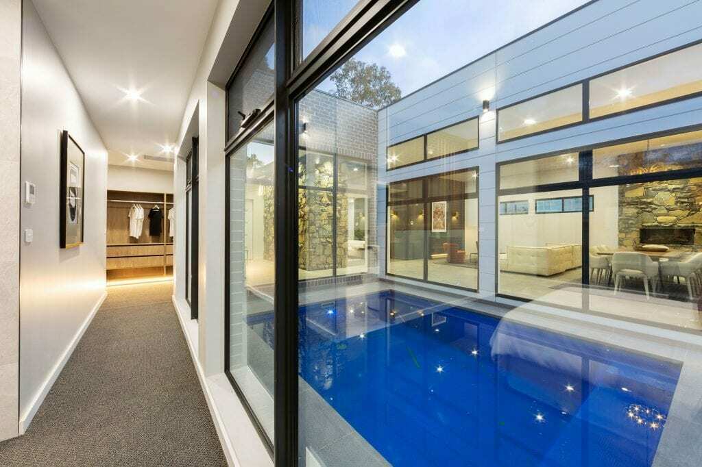 Homes by Howe, knock down rebuild, Deakin, courtyard pool, windows look in to open plan living area