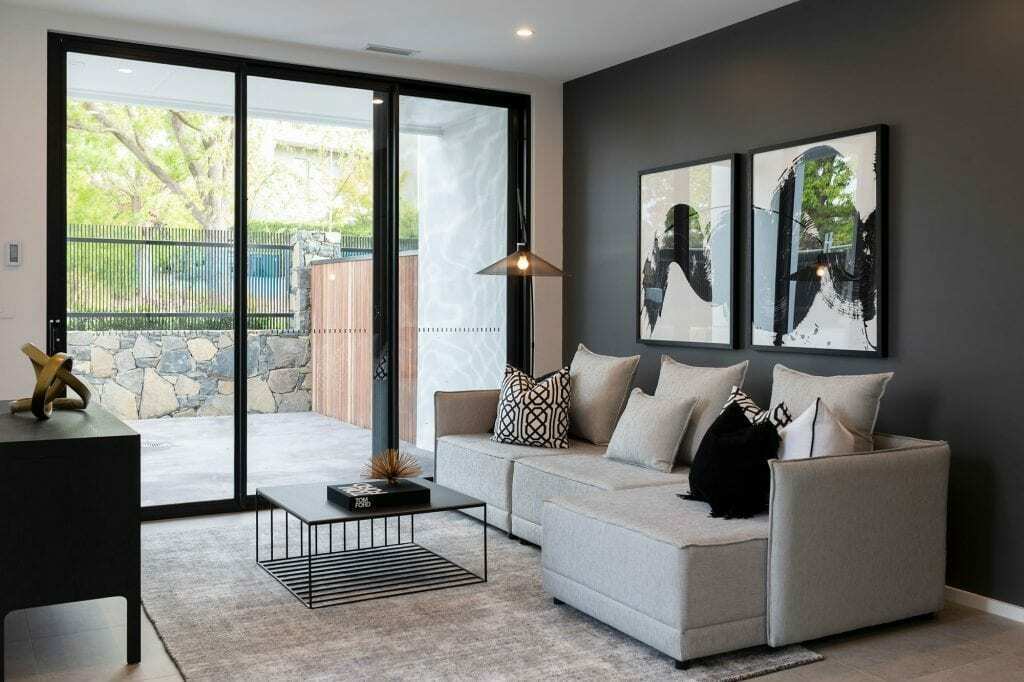 Homes by Howe, knock down rebuild, Red Hill, living room, floor to ceiling windows and sofa