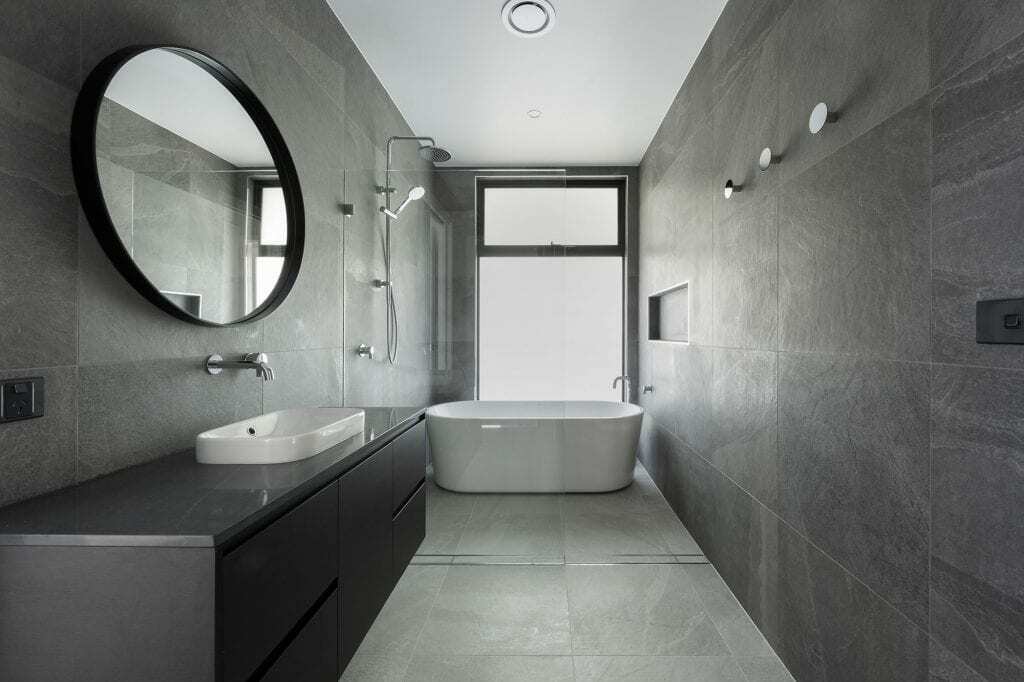 Homes by Howe, knock down rebuild, Red Hill, bathroom, grey slate tiling, stand alone bath