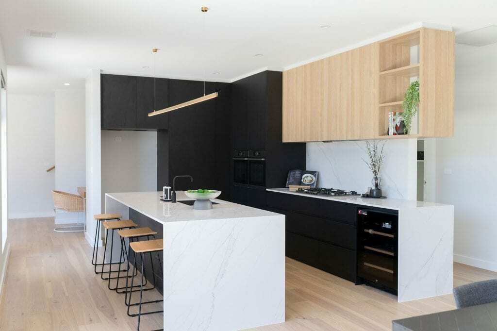 Homes by Howe, knock down rebuild, Red Hill, kitchen, white marble island, light floorboards, black cupboards