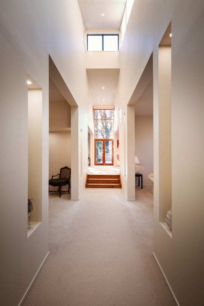 Homes by Howe, renovation, Griffith, hallway looking down to front door, large apertures leading off to other rooms