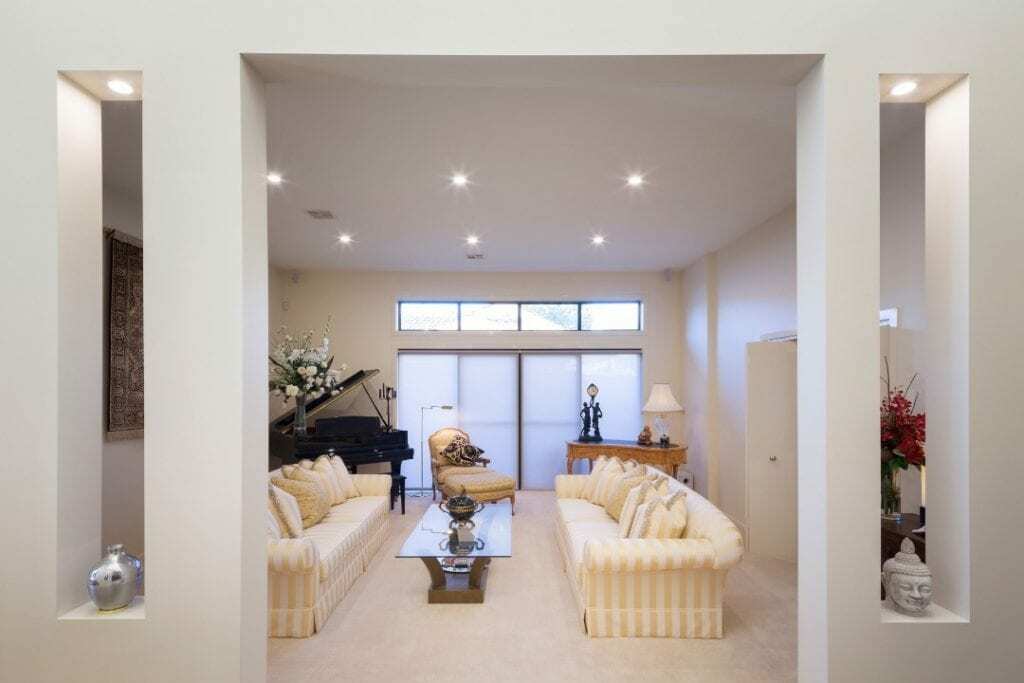 Homes by Howe, renovation, Griffith, living room, large cream sofa and cream carpet