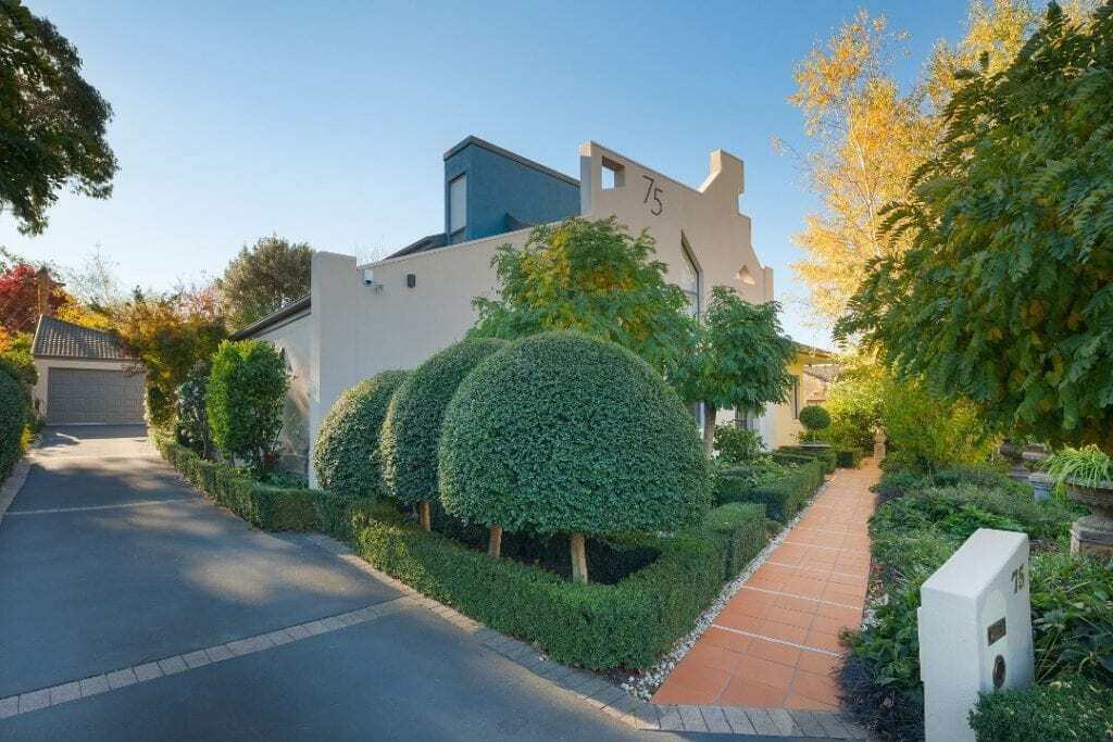 Homes by Howe, renovation, Griffith, exterior, brick path and sculpted bushes