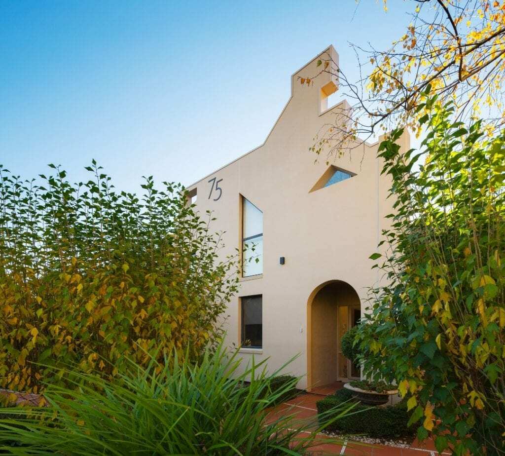 Homes by Howe, renovation, Griffith, exterior, triangular windows and asymmetric exterior rendered facade, birch trees trickle over front