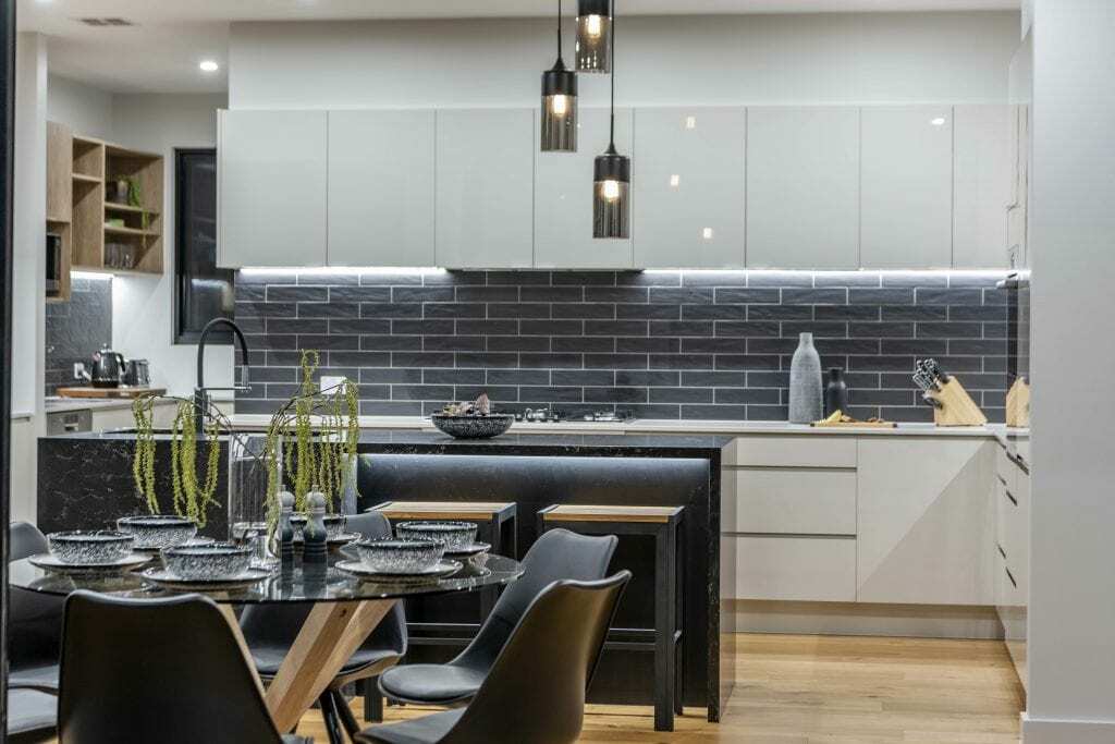 Homes by Howe, new build, Denman, kitchen, midnight marble island with pendants above and wooden flooring