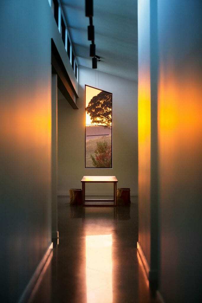 Homes by Howe, new build, Burra, hallway at sunset, polished concrete floors, high roof and window at end like a chapel