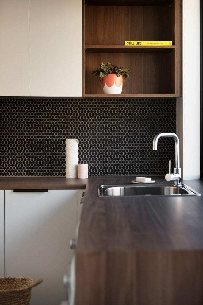 Homes by Howe, new build, Burra, laundry, sink with black tile splashback and dark wooden benchtops