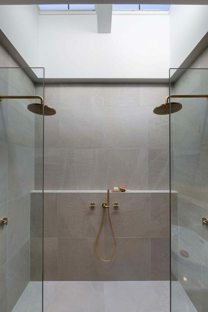 Homes by Howe, knock down rebuild, Chapman display home, bathroom, dual gold shower heads and grey slate tiling