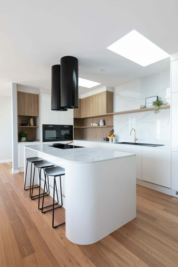 Homes by Howe, knock down rebuild, Chapman display home, kitchen, Miele extractor fan, sink and induction cook top