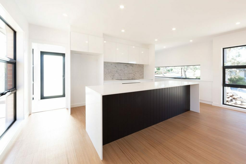 Homes by Howe, knock down rebuild, Duffy, kitchen, large island with talostone white benchtops, light wood flooring