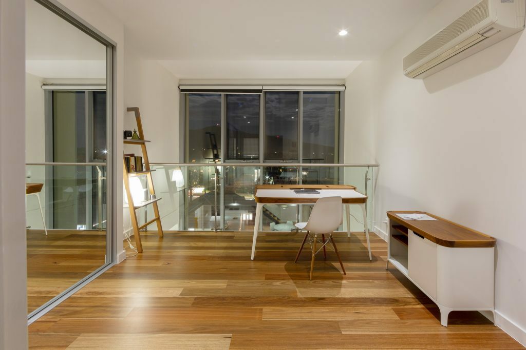 Homes by Howe, renovation, Braddon, mezzanine level, looking out high windows, light wooden flooring