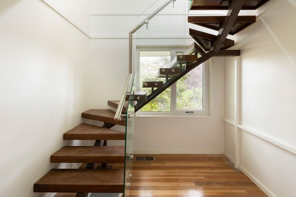 Homes by Howe, renovation, Cook, wooden staircase with glass railing, spiral